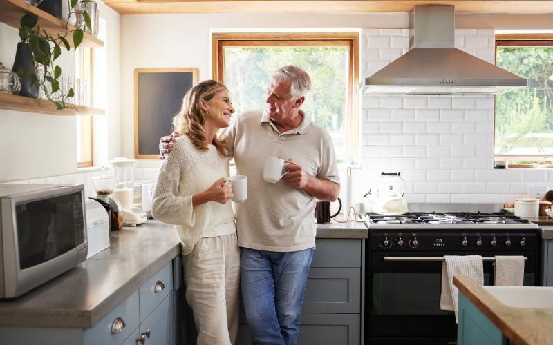 a man and a woman holding cups